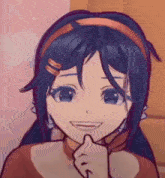 a close up of a cartoon girl with blue hair and a red headband making a funny face .