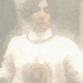 a close up of a person 's face with piercings in their ears and nose .