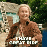 a woman says " i have great ride " in front of a ladder