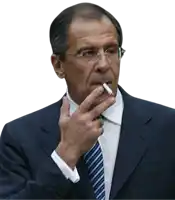 a man in a suit smoking a cigarette