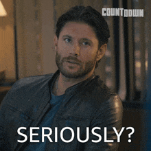 a man in a leather jacket says seriously on the screen