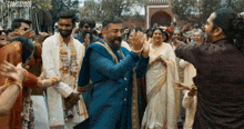 a group of people dancing in front of a sign that says toms120905