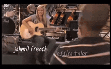 a woman playing a guitar next to a man with the name jahmil french written on it