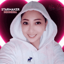 a woman wearing a white hoodie with a moose on it and the words starmaker indonesia