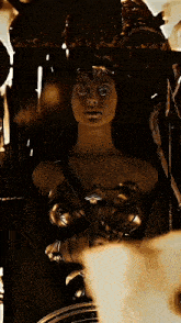 a woman in a wonder woman costume is holding a sword in front of a clock