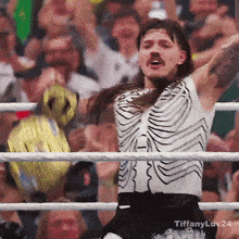 a man in a skeleton costume is in a wrestling ring