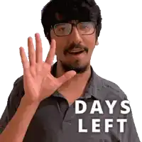 a man with glasses and a beard waving his hand with the words days left behind him