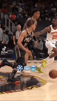 a basketball player wearing a number 25 jersey is dribbling the ball