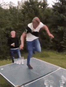 Destroying A Ping Pong Table Slam GIF
