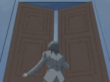a man in a suit is kneeling down in front of a wooden door