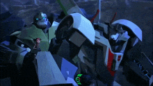 a couple of transformers are standing next to each other and one of them has the letter r on it