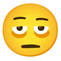 a yellow smiley face with a tired look on it