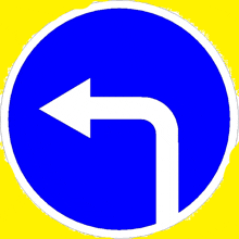 a blue sign with a white arrow pointing left