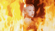 a woman in a louis vuitton dress is standing in front of a fire