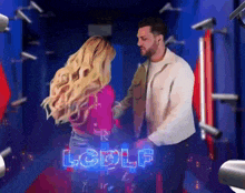 a man and a woman are standing next to each other with the word lcdlp on the bottom