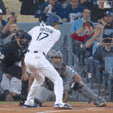 a baseball player named ohtani is about to swing at a pitch
