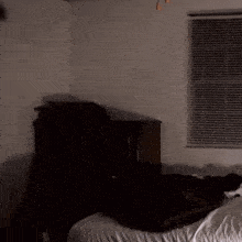 a blurry picture of a man in a dark room