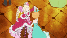 a girl in a pink dress is dancing with another girl in a blue dress