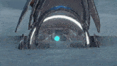 a video game character is laying on the ground with a blue light shining on it