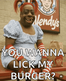 a wendy 's sign is behind a woman in a wendy 's costume