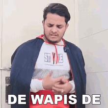 a man wearing a cape and a sweatshirt that says style