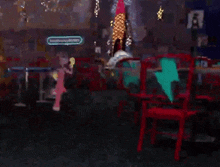 a blurry picture of a room with red chairs and a sign that says ' a ' on it .