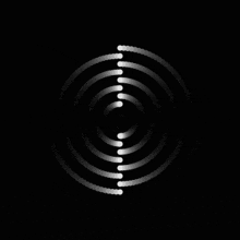 a black background with white circles that look like a spiral