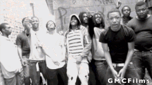 a group of young men are posing for a photo with gmc films written on the bottom right
