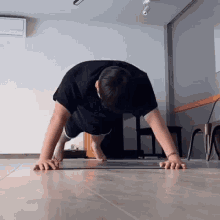 a man is doing push ups on a yoga mat