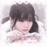 a close up of a girl 's face with the words yubin de regi written on the bottom .