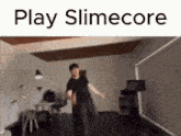 a man is dancing in a room with the words play slimecore written above him