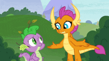 two cartoon dragons are standing next to each other in a field