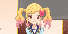 a girl with pigtails and a bow in her hair is smiling