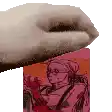 a close up of a person 's hand holding a pink box with a picture of a woman on it .