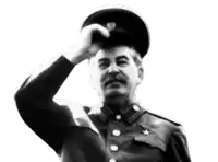 a black and white photo of a man in a military uniform .