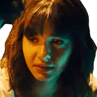 a close up of a woman 's face with a tear coming out of her nose