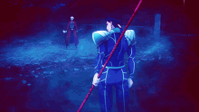 a blue light is shining on a person in a dark area