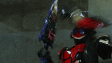 a person in a red and black costume with a sword in their hand