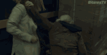 a woman is fighting another woman with #hannatv written on the corner