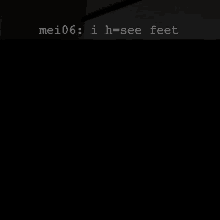 a dark room with a sign that says mei06 i h see feet