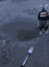 a person is holding a torch in front of a large fire