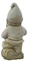 a statue of a gnome with a beard and a hat on