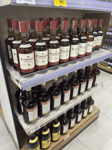 several bottles of fundado are on a shelf