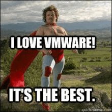 a man in a superhero costume is standing on top of a hill and saying `` i love vmware ! ''