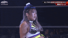 a woman in a wrestling ring with the words all star grand queendom 2025 on the bottom right