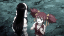a girl with red hair is standing next to a girl with black hair