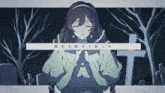 a girl is praying in front of a cross in a cemetery ..