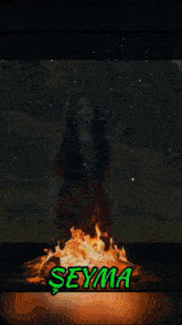 a phone screen shows a fire and the name seyma in green
