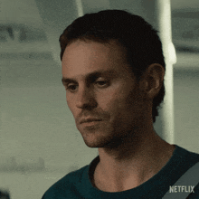 a close up of a man 's face with a netflix logo on the bottom right