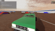 a screenshot of a video game with a green monster truck in the foreground